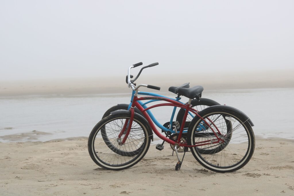 Bicycles beside a summer beach evoking the long, memorable days of childhood.