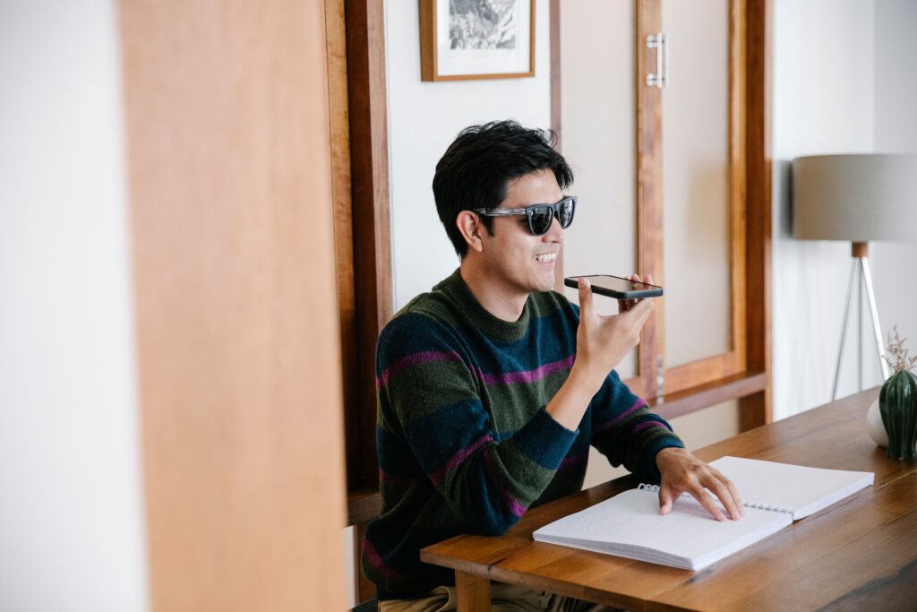 Smartphone displaying an audio recording interface while capturing a personal voice memory.