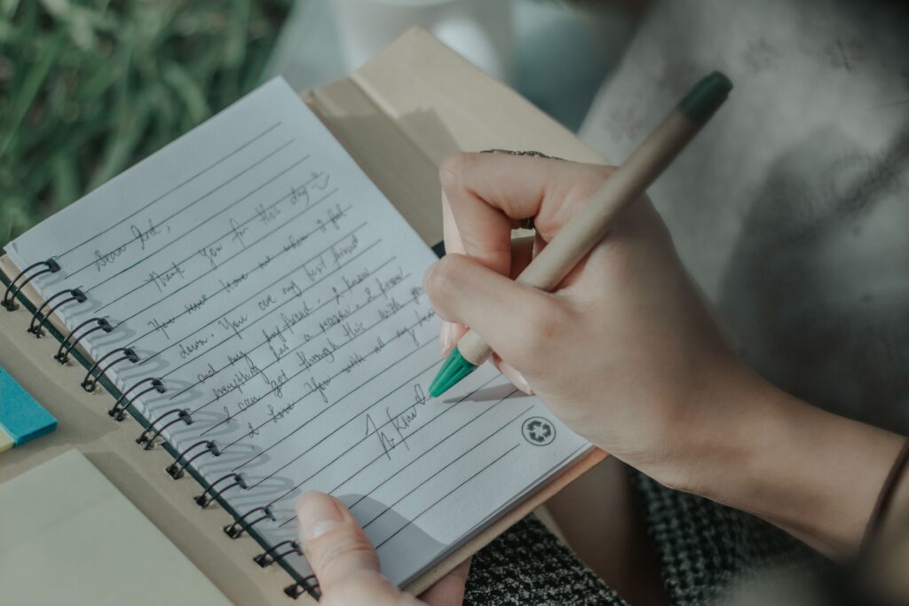 Open notebook and pen ready for writing a personal letter to the future.