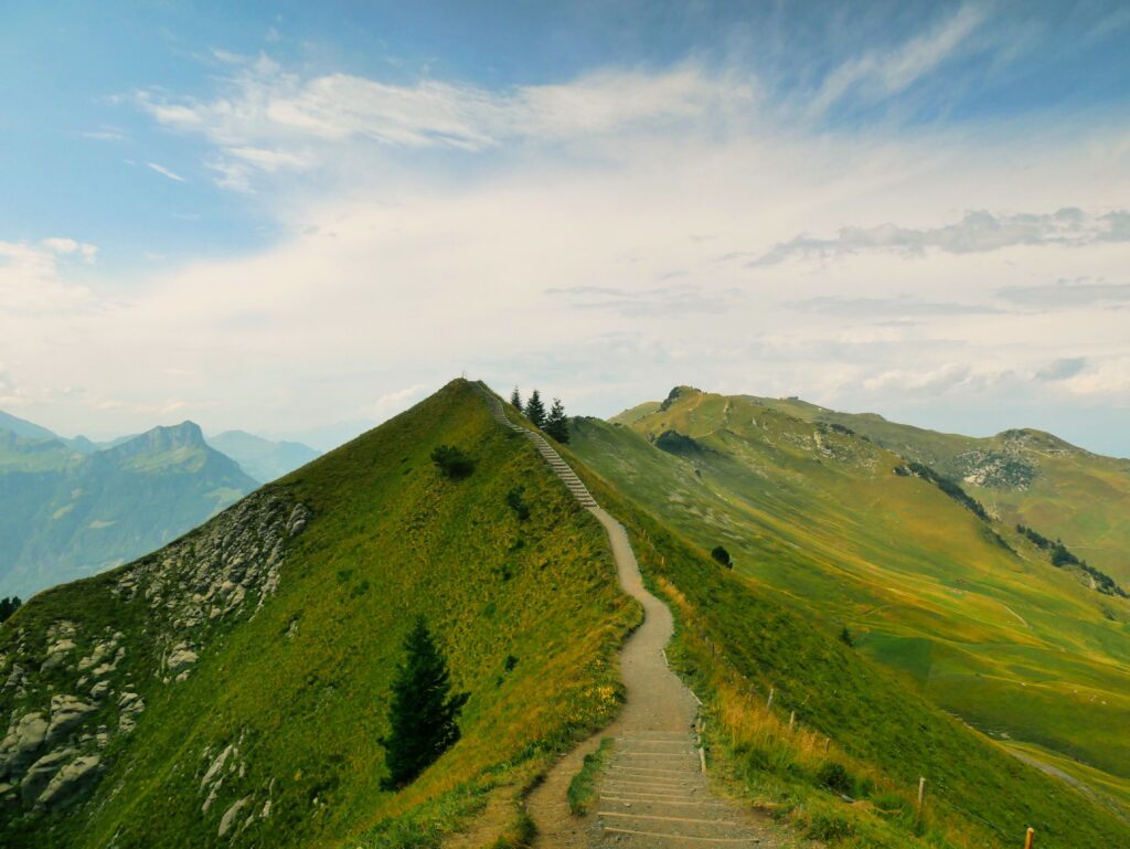 Winding mountain path symbolising the journey of finding direction in life.